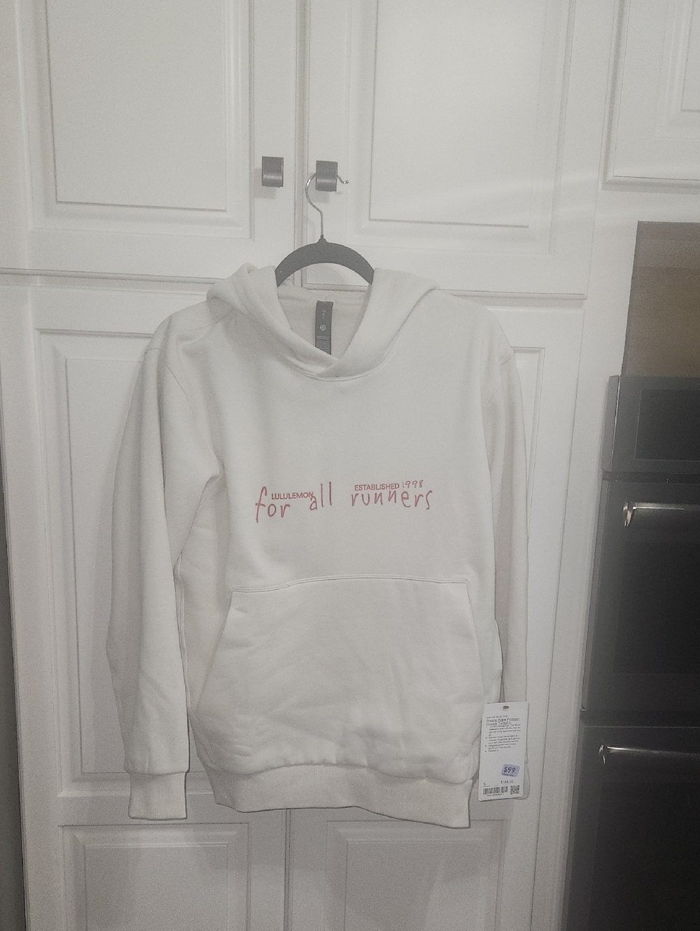 lululemon athletica white hoodie with red logo text